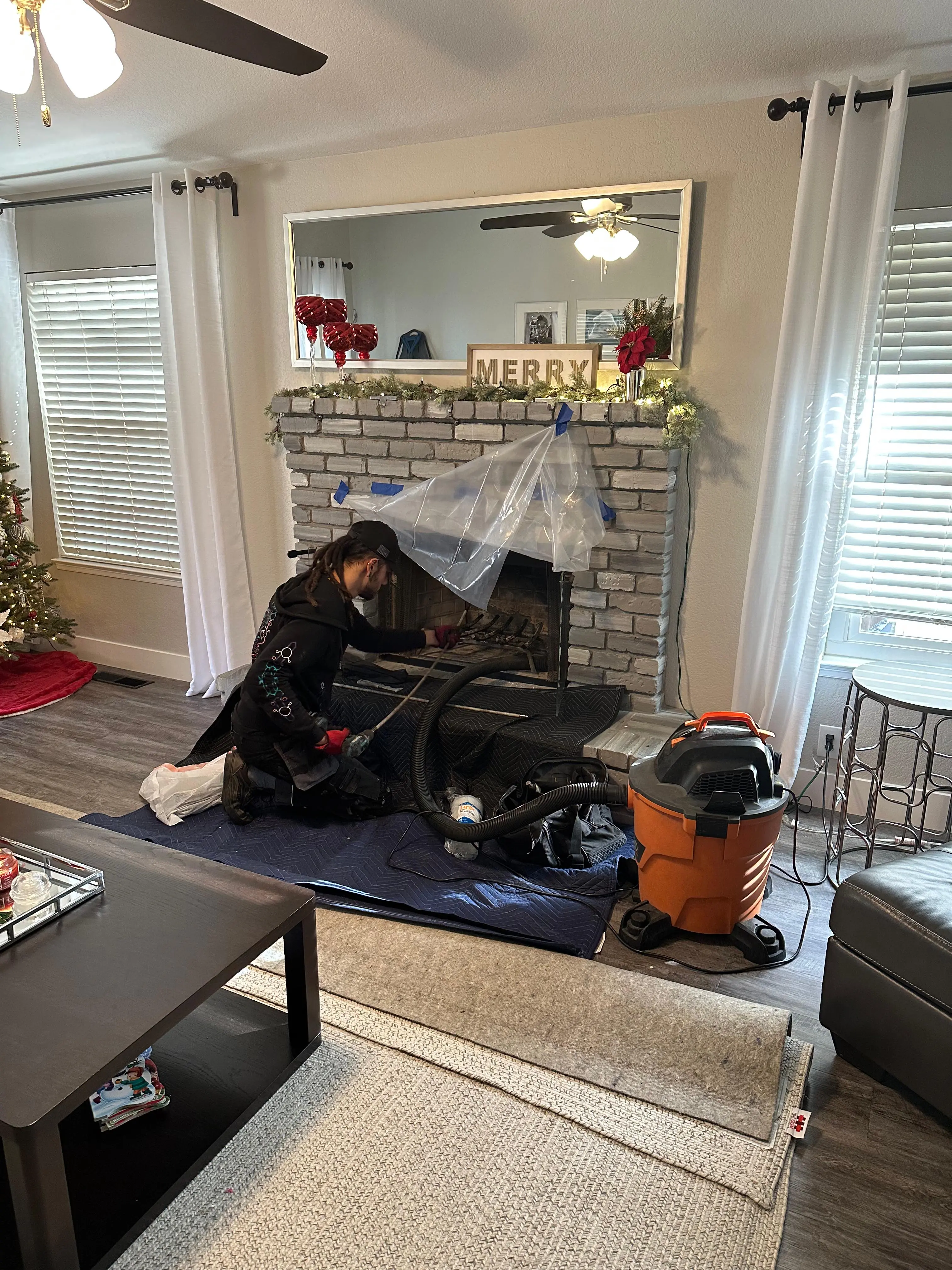 ABC Chimney Fireplace Services certified technician performing a chimney sweep in Sacramento CA